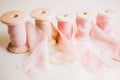 Chiffon ribbons wrapped on wooden bobbins