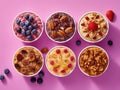 Five bowls of oatmeal with berries and nuts on a pink background