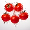 Five bright and ripe colored tomatoes with water dripping around them on a white background