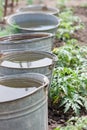 Five buckets with water Royalty Free Stock Photo