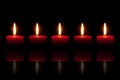 Five burning red candles Royalty Free Stock Photo