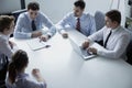 Five business people having a business meeting at the table in the office Royalty Free Stock Photo
