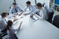 Five business people having a business meeting at the table in the office Royalty Free Stock Photo