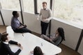 Five business people sitting at a conference table and discussing during a business meeting Royalty Free Stock Photo