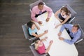 Five businesspeople at boardroom table Royalty Free Stock Photo