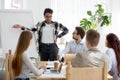 Five businesspeople at seminar in conference room