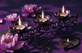 five candle stand on a purple background with lotus flower and a lotus ring Royalty Free Stock Photo