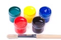 Five cans with bright acrylic paints