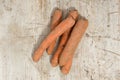 Five Carrots on a Wooden Background