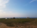 Cars and caravans in front of the sea