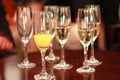 Five champagne flutes with champagne and bucks fizz Royalty Free Stock Photo