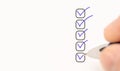 five checkboxes. hand with pen writing check mark on Checklist. Cropped Hand Marking On Check Box on white paper. Completed tasks Royalty Free Stock Photo