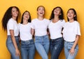 Five Cheerful Females Millennials Laughing Standing Over Yellow Background