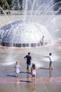 Five Children looking at and Playing in Seattle Fountain