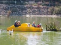 Five children ride on a water bike