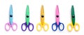 Five children`s pinking shears in a row