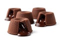 Five chocolate lava cakes on a white background feature a rich, Royalty Free Stock Photo