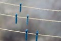 Five Clothespins on empty clothesline. Royalty Free Stock Photo