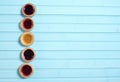 Five colourful jam tarts on a blue background Royalty Free Stock Photo