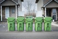 Five Condo Garbage Cans Waiting For The Dump Truck