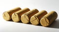 Five corks lined up object close up detail light colored background Royalty Free Stock Photo