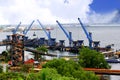 Five crane unloading on port coal Royalty Free Stock Photo