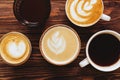 Five cups of coffee on vintage wood. Top view , cup on wooden table.