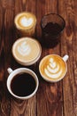 Five cups of coffee on vintage wood. Top view , cup on wooden table.