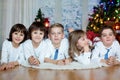 Five cute children, brothers, sister, siblings and friends, having fun on Christmas Royalty Free Stock Photo