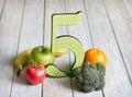 5 Five a day portion size with fresh fruits and vegetables healthy diet lifestyle concept Royalty Free Stock Photo