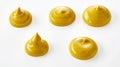 Five decorative twirls of yellow mustard on white Royalty Free Stock Photo