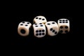 Five dices on a black background ready for starting the games Royalty Free Stock Photo