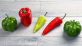 Five different kinds of pepper on a wooden board Royalty Free Stock Photo