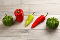 Five different kinds of pepper on a wooden board Royalty Free Stock Photo