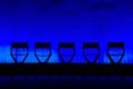 Five Director's Chairs silhouette on Blue Stage Royalty Free Stock Photo