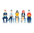 Five diverse professionals sitting in a row on chairs, waiting for interview. Job candidates diverse team waiting Royalty Free Stock Photo