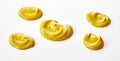 Five dollops of mustard with different shapes Royalty Free Stock Photo