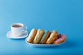 Five donuts on blue background