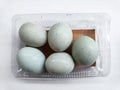 Five duck eggs placed in a plastic bowl Royalty Free Stock Photo