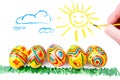 Five easter eggs on grass, sun in sky Royalty Free Stock Photo