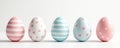 Five Easter eggs stand in a row. Eggs feature pastel colors with stripes dots and hearts. Light background. Minimalistic spring Royalty Free Stock Photo