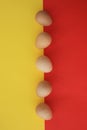 Five eggs of Guinea fowl on red and yellow