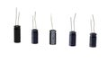 Five electrolytic capacitors on a white background Royalty Free Stock Photo