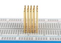 Five electronic components vertically inserted into a breadboard for prototyping Royalty Free Stock Photo