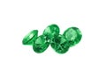 Five emeralds on a white background