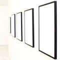 Five empty frames on white wall exhibition