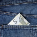 Five Euro banknote in trouser pocket Royalty Free Stock Photo
