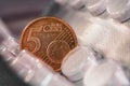 Five euro cent coin on a pack of pills Royalty Free Stock Photo