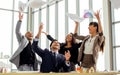 Five female and male Caucasian smart businesspeople wearing formal suit, working together with teamwork, smiling, throwing project Royalty Free Stock Photo