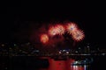 five fireworks on beach and reflection color on water surface